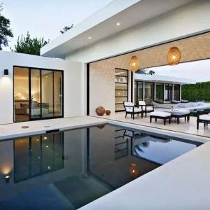 Coping tiles in white around an outdoor pool/dining area.